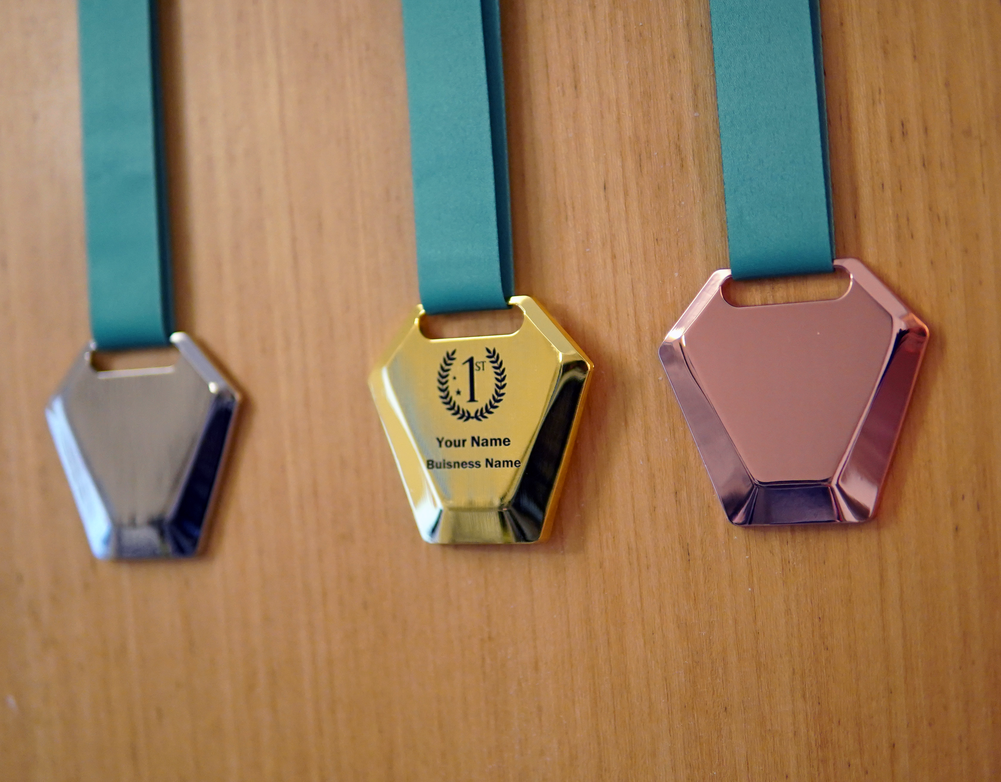 Engraved medals, angled view
